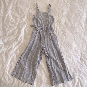 Old Navy pant romper with waist tie and pockets.